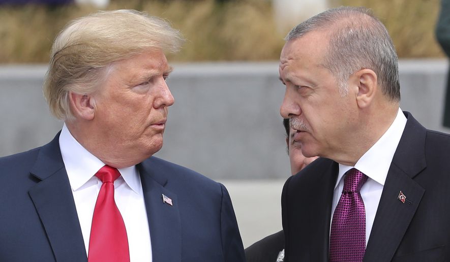 U.S. President Donald Trump, left, talks to Turkish President Recep Tayyip Erdogan, right, as they tour the new NATO headquarters in Brussels, Belgium, Wednesday, July 11, 2018. NATO countries&#39; heads of states and governments gather in Brussels for a two-day meeting. (Presidency Press Service via AP, Pool)
