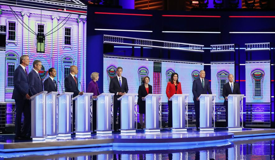 Democratic presidential candidates from left, New York City Mayor Bill de Blasio, Rep. Tim Ryan, D-Ohio, former Housing and Urban Development Secretary Julian Castro, Sen. Cory Booker, D-N.J., Sen. Elizabeth Warren, D-Mass., former Texas Rep. Beto O’Rourke, Sen. Amy Klobuchar, D-Minn., Rep. Tulsi Gabbard, D-Hawaii, Washington Gov. Jay Inslee, and former Maryland Rep. John Delaney participate in a Democratic primary debate hosted by NBC News at the Adrienne Arsht Center for the Performing Arts, Wednesday, June 26, 2019, in Miami. (AP Photo/Wilfredo Lee)