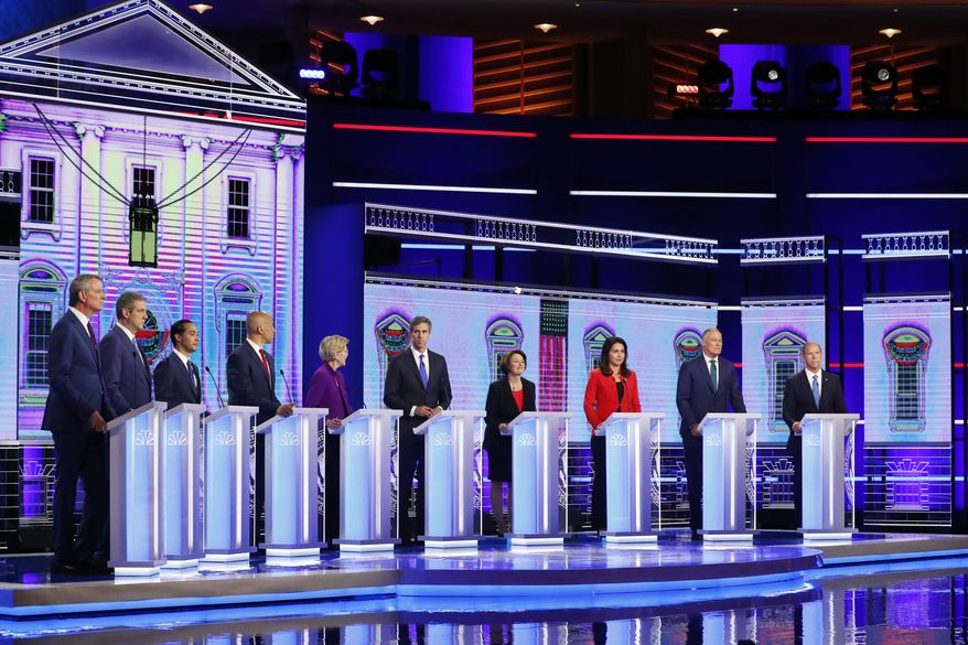 Democratic presidential candidates from left, New York City Mayor Bill de Blasio, Rep. Tim Ryan, D-Ohio, former Housing and Urban Development Secretary Julian Castro, Sen. Cory Booker, D-N.J., Sen. Elizabeth Warren, D-Mass., former Texas Rep. Beto O’Rourke, Sen. Amy Klobuchar, D-Minn., Rep. Tulsi Gabbard, D-Hawaii, Washington Gov. Jay Inslee, and former Maryland Rep. John Delaney participate in a Democratic primary debate hosted by NBC News at the Adrienne Arsht Center for the Performing Arts, Wednesday, June 26, 2019, in Miami. (AP Photo/Wilfredo Lee)