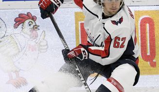 FILE - In this March 16, 2019, file photo, Washington Capitals left wing Carl Hagelin skates with the puck during the third period of an NHL hockey game against the Tampa Bay Lightning in Tampa, Fla. Hagelin is one of several players who could’ve probably cashed out even richer contracts by going to free agency and opted instead to re-sign with their current teams. (AP Photo/Jason Behnken, File)
