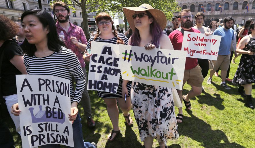 Employees of Wayfair march to Copley Square in protest prior to their rally in Boston, Wednesday, June 26, 2019. Employees at online home furnishings retailer Wayfair walked out of work to protest the company&#39;s decision to sell $200,000 worth of furniture to a government contractor that runs a detention center for migrant children in Texas. (AP Photo/Charles Krupa)