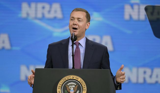 In this April 26, 2019, file photo, National Rifle Association Institute for Legislative Action Executive Director Christopher W. Cox speaks at the NRA-ILA Leadership Forum in Lucas Oil Stadium in Indianapolis. The National Rifle Association&#x27;s top lobbyist has resigned in another sign of infighting within the powerful gun lobbying group, Wednesday, June 26, 2019. Cox&#x27;s departure comes just days after the NRA placed him on administrative leave, claiming he was part of a failed attempt to extort the longtime CEO. (AP Photo/Michael Conroy, File)