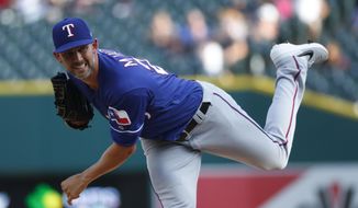 Texas Rangers pitcher Mike Minor throws against the Detroit Tigers in the first inning of a baseball game in Detroit, Wednesday, June 26, 2019. (AP Photo/Paul Sancya)