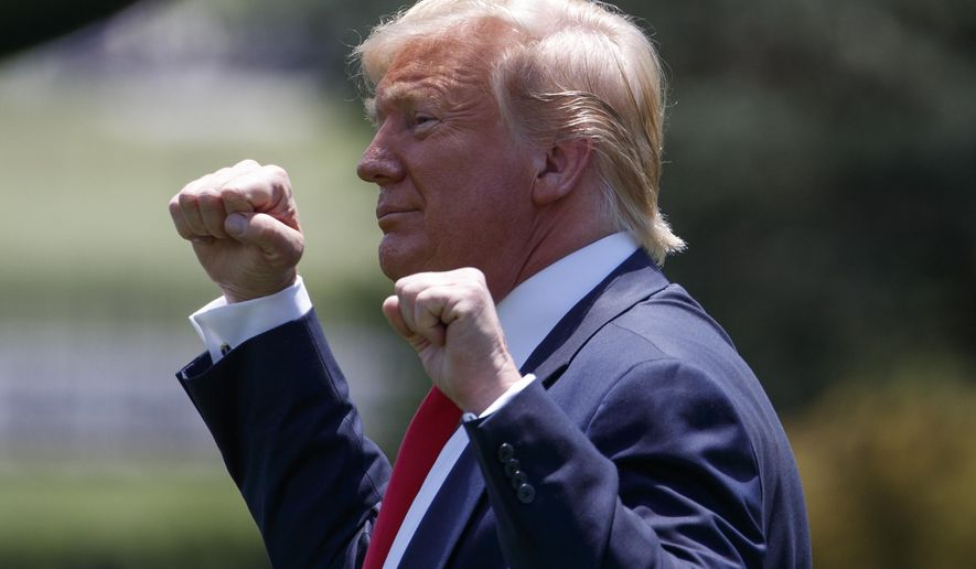 President Donald Trump gestures as he walks to Marine One across the South Lawn of the White House in Washington, Wednesday, June 26, 2019, for the short trip to Andrews Air Force Base en route to Japan for the G-20 summit.(AP Photo/Carolyn Kaster)