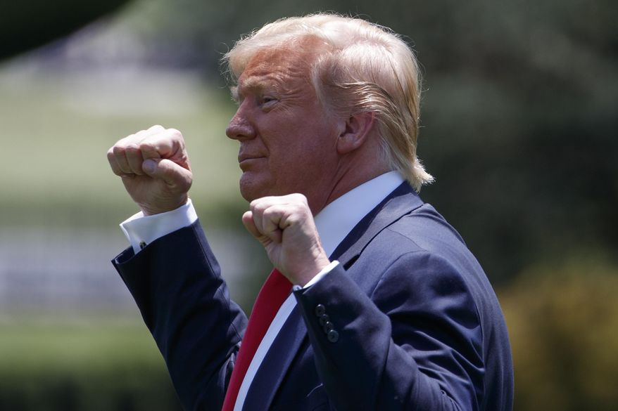 President Donald Trump gestures as he walks to Marine One across the South Lawn of the White House in Washington, Wednesday, June 26, 2019, for the short trip to Andrews Air Force Base en route to Japan for the G-20 summit.(AP Photo/Carolyn Kaster)