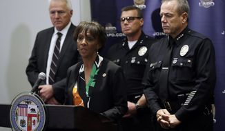 Los Angeles County District Attorney Jackie Lacey, second from left, addresses the media regarding the arrest of Dr. George Tyndall, Wednesday, June 26, 2019, in Los Angeles. Tyndall was charged today with sexually assaulting multiple women at the student health center while he worked as a gynecologist at the University of Southern California, the Los Angeles County District Attorney&#39;s Office announced. (AP Photo/Marcio Jose Sanchez)