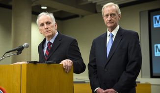 D.C. City Council Member Jack Evans, right, and Metro General Manager Paul Wiedefeld listen to a question during a news conference in this March 2016 file photo. On Aug. 8, 2019, Mr. Evans agreed to a consent settlement with the city&#39;s ethics board to resolve its concerns about his reprimand by the council for his use of official resources to conduct personal business. (AP Photo/Evan Vucci) ** FILE **


