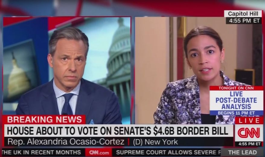 CNN'S Jake Tapper questions New York Rep. Alexandria Ocasio-Cortez about her criticism of "concentration camps" along the U.S. border with Mexico, June 27, 2019. The Democrat was asked if she called detention centers the same thing when former president's Bill Clinton and Barack Obama occupied the White House. (Image: CNN screenshot)