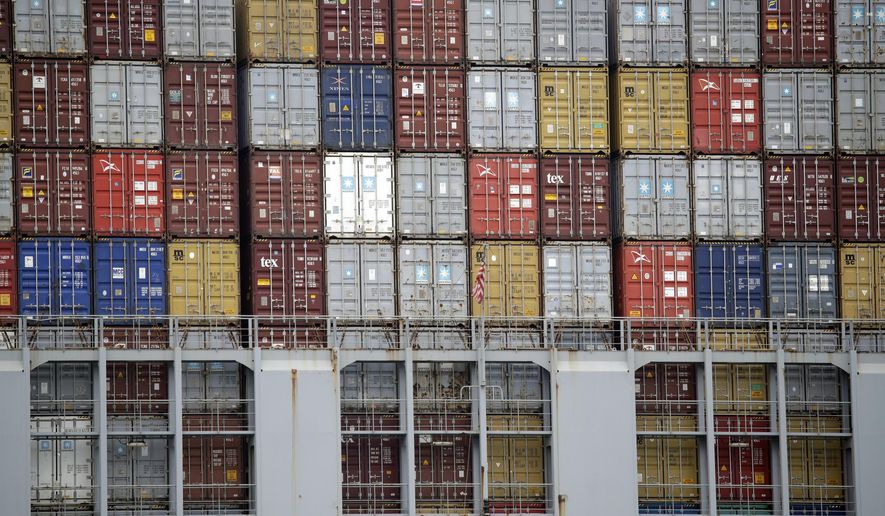 FILE - In this June 19, 2019, file photo cargo containers are stacked on a ship at the Port of Los Angeles in Los Angeles. On Thursday, June 27, the Commerce Department issues the third and final estimate of how the U.S. economy performed in the January-March quarter. (AP Photo/Marcio Jose Sanchez, File)