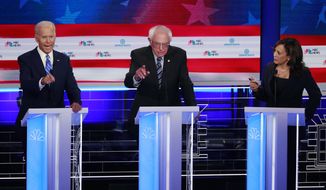 Democratic presidential candidate former vice president Joe Biden, left, Sen. Bernie Sanders, I-Vt., and Sen. Kamala Harris, D-Calif., all talk at the same time during the Democratic primary debate hosted by NBC News at the Adrienne Arsht Center for the Performing Arts, Thursday, June 27, 2019, in Miami. (AP Photo/Wilfredo Lee) **FILE**