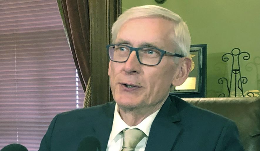 FILE - In this April 17, 2019, file photo, Wisconsin Gov. Tony Evers speaks during a news conference in Madison, Wisconsin. The U.S. Supreme Court's ruling Thursday, June 27 that federal courts have no place in policing political district boundaries means a challenge to Republican-drawn legislative boundaries in Wisconsin is likely over, leaving Democrats with little hope of gaining ground heading into the 2020 elections. Evers, a Democrat, issued a statement Thursday calling the U.S. Supreme Court's ruling "devastating for our democracy" and promising to veto any gerrymandered maps that land on his desk. (AP Photo/Scott Bauer, File)