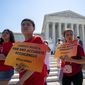Young demonstrators gather at the Supreme Court as the justices finish the term with key decisions on gerrymandering and a census case involving an attempt by the Trump administration to ask everyone about their citizenship status in the 2020 census, on Capitol Hill in Washington, Thursday, June 27, 2019. (AP Photo/J. Scott Applewhite)