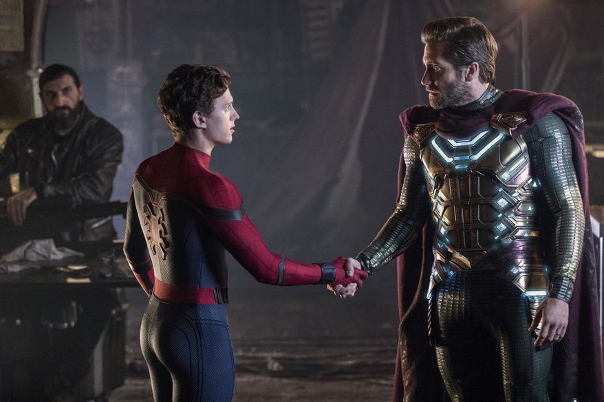 This image released by Sony Pictures shows, from left, Numan Acar, Tom Holland and Jacky Gyllenhaal in a scene from "Spider-Man: Far From Home." (Jay Maidment/Columbia Pictures/Sony via AP)