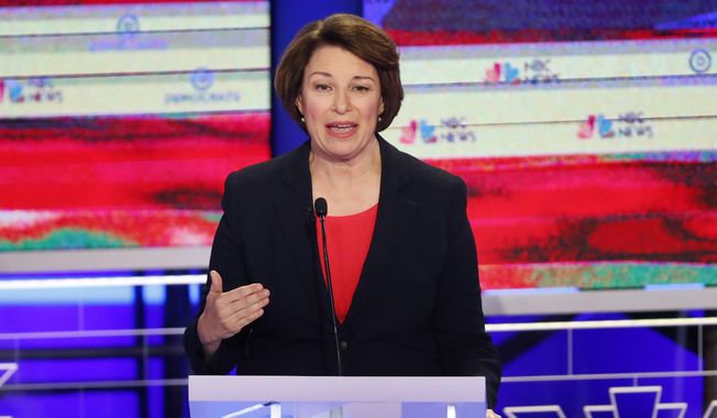 In this June 26, 2019, photo, Democratic presidential candidate Sen. Amy Klobuchar, D-Minn., gestures, during a Democratic primary debate hosted by NBC News at the Adrienne Arsht Center for the Performing Arts in Miami. It’s been tough to run for the Democratic presidential nomination as a moderate if your name isn’t Joe Biden. But some candidates hope that’s changing. (AP Photo/Wilfredo Lee)