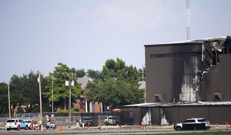 Damage is seen to a hangar after a twin-engine plane crashed into the building at Addison Airport in Addison, Texas, Sunday, June 30, 2019. The small airplane crashed as it was taking off from the Dallas-area airport Sunday morning, a spokeswoman for the town of Addison, Texas, said. (Shaban Athuman/The Dallas Morning News via AP)