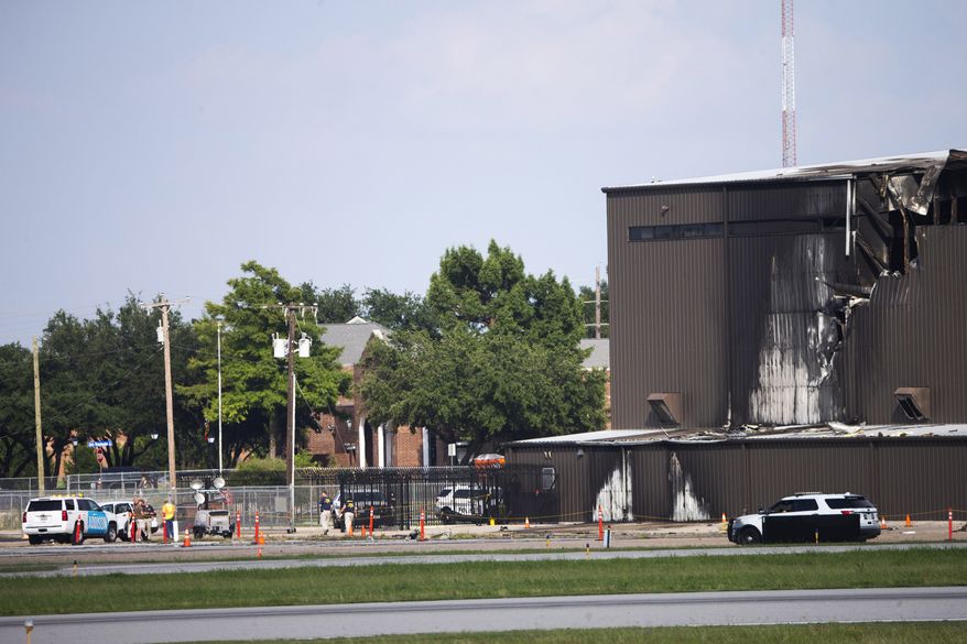 Damage is seen to a hangar after a twin-engine plane crashed into the building at Addison Airport in Addison, Texas, Sunday, June 30, 2019. The small airplane crashed as it was taking off from the Dallas-area airport Sunday morning, a spokeswoman for the town of Addison, Texas, said. (Shaban Athuman/The Dallas Morning News via AP)