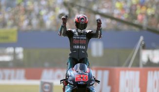 France&#39;s rider Fabio Quartararo of the Petronas Yamaha SRT celebrates after finishing third at the MotoGP race during the Dutch Grand Prix in Assen, northern Netherlands, Sunday, June 30, 2019. (AP Photo/Peter Dejong)
