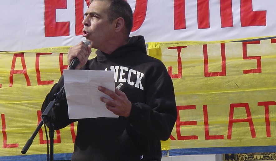This Oct. 27, 2007, photo provided by Antiwar.com shows its co-founder Justin Raimondo in San Francisco. Raimondo, a longtime gay rights advocate and antiwar activist, has died. He was 67. Friend Eric Garris said Sunday, June 30, 2019, that Raimondo died Thursday, June 27, after battling lung cancer. (Yoshinori Abe via AP)