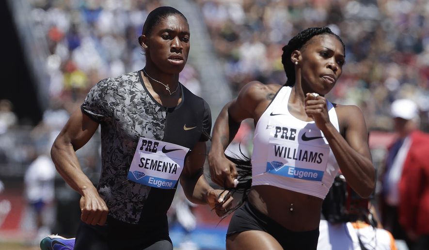 South Africa's Caster Semenya, left, runs next to the United States' Chrishuna Williams during the women's 800-meter race during the Prefontaine Classic, an IAAF Diamond League athletics meeting, in Stanford, Calif., Sunday, June 30, 2019. Semenya won the race. (AP Photo/Jeff Chiu)