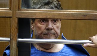 Dr. George Tyndall, 72, listens during an arraignment at Los Angeles Superior court, Monday, July 1, 12019, in Los Angeles. The former longtime gynecologist at the University of Southern California is charged with sexually assaulting 16 women at the student health center. (AP Photo/Richard Vogel)