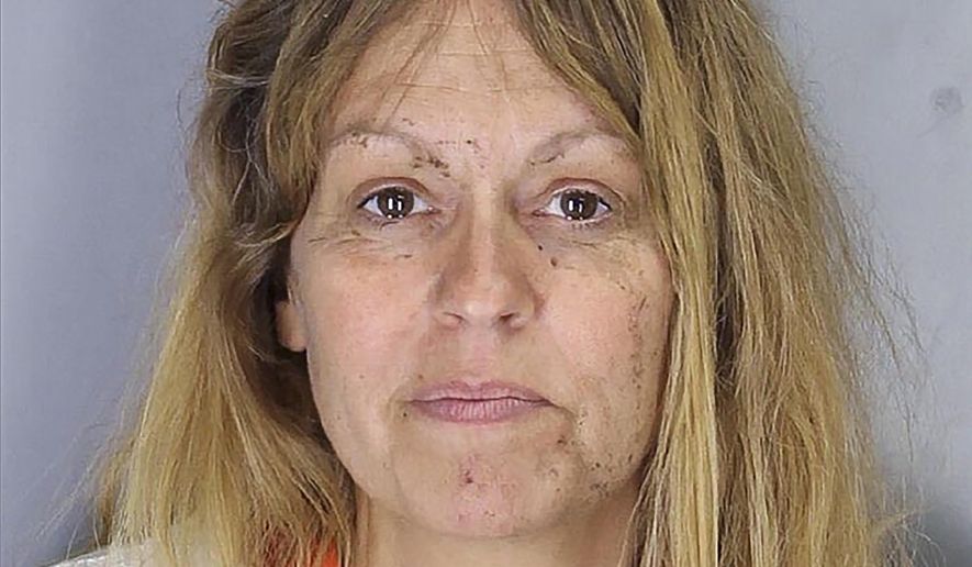 This Saturday, June 29, 2019, police booking photo provided by the Tulare County Sheriff's Department shows Sherri Renee Telnas. Telnas was arrested Saturday on suspicion of killing her 12-year-old son and critically injuring her 7-year-old son who were found unresponsive in a ditch. (Tulare County Sheriff's Office via AP)