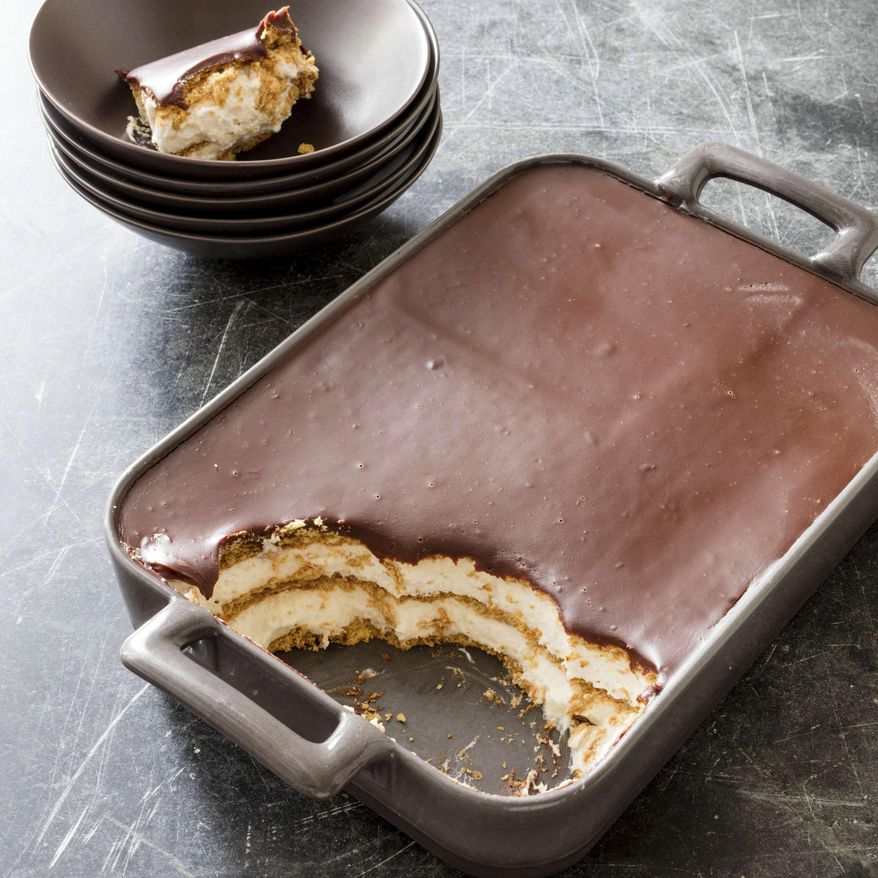 This undated photo provided by America's Test Kitchen in June 2019 shows a Chocolate Eclair Cake in Brookline, Mass. This recipe appears in the cookbook “The Perfect Cake.” (Daniel J. van Ackere/America's Test Kitchen via AP)