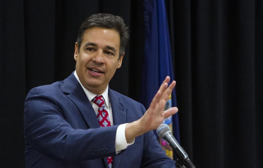 FILE - In this June 29, 2019 file photo, Raul Labrador addresses members of the Idaho Republican Party after being voted as their party chairman during a meeting at the Boise Centre in downtown Boise, Idaho. The former U.S. Representative from Idaho narrowly won the 111-109 vote over nominee Tom Luna. (Darin Oswald/Idaho Statesman via AP, File)