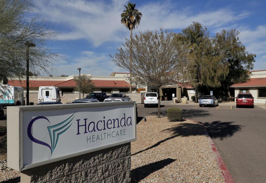 FILE - This Jan. 25, 2019, file photo shows the Hacienda HealthCare facility in Phoenix, where an incapacitated patient was raped and later gave birth. A nurse has been charged with sexually assaulting the patient. Family members of patients at Hacienda held a news conference Monday, July 1, 2019, to say the sexual assault was a tragic yet isolated encounter that didn't reflect the professionalism and compassion of its other employees. (AP Photo/Matt York, File)