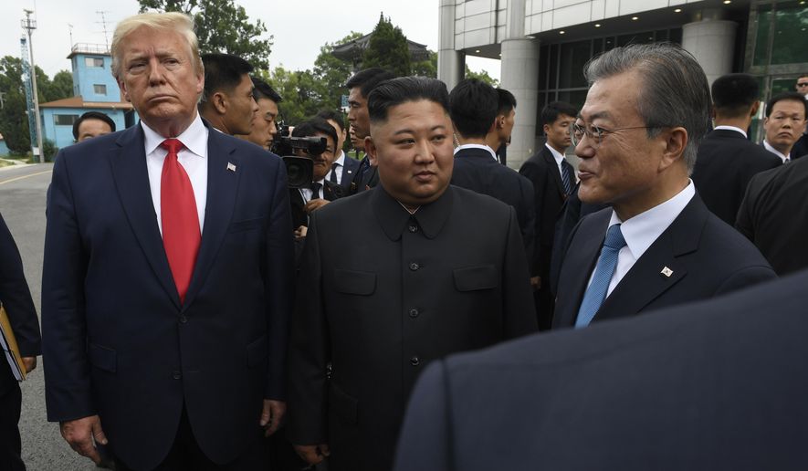 President Donald Trump, left, North Korean leader Kim Jong-un, center, and South Korean President Moon Jae-in, right, walk together at the border village of Panmunjom in Demilitarized Zone, South Korea, Sunday, June 30, 2019. (AP Photo/Susan Walsh) **FILE**