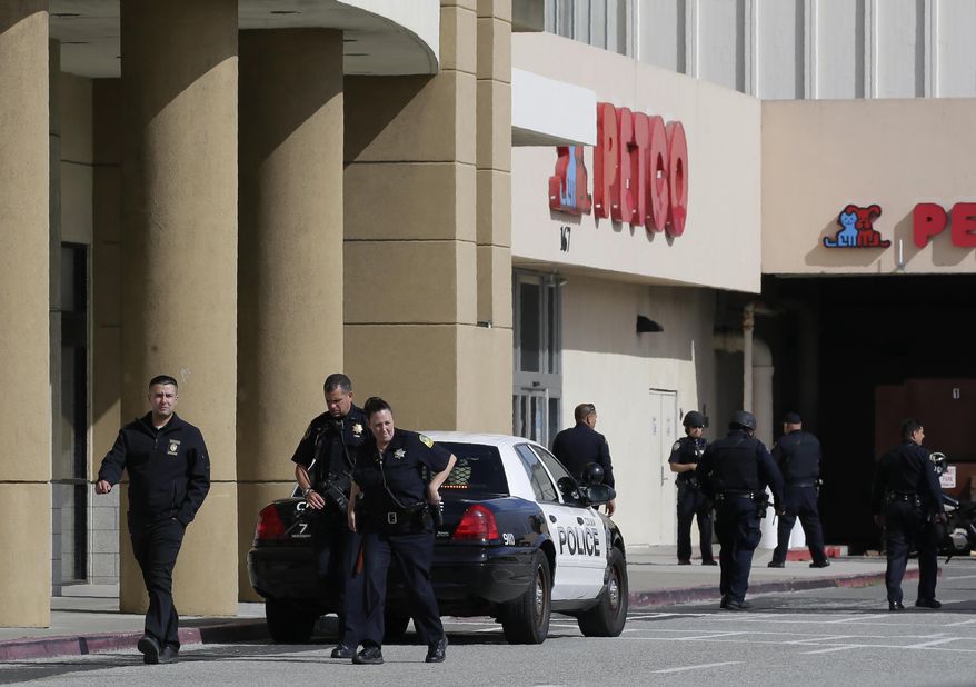 Police investigate at the scene of a shooting at the Tanforan Mall in San Bruno, Calif., Tuesday, July 2, 2019. Police are searching for suspects after at least two people were wounded in a mall shooting near San Francisco on Tuesday that led to region-wide transit delays at rush hour. (AP Photo/Stephanie Mullen)