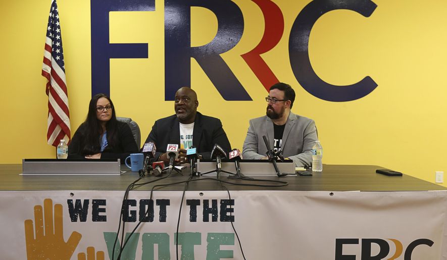 Left to Right, Jessica Younts, Florida Rights Restoration Coalition, director of operations; Desmond Meade, executive director Florida Rights Restoration Coalition; and Neil Volz, Florida Rights Restoration Coalition, political director— The Florida Rights Restoration Coalition holds a press conference to discuss a vote-registration campaign, on Tuesday, July 2, 2019. The Coalition helped lead efforts to pass a constitutional amendment aimed at restoring voting rights of felons. (Ricardo Ramirez Buxeda/Orlando Sentinel via AP)