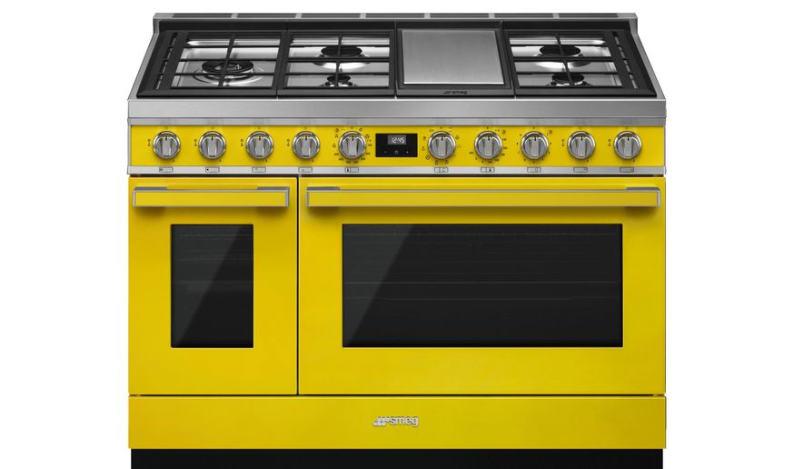 This photo provided by SMEG USA shows one of their yellow ranges. If you're keen to take a bigger leap into yellow beyond just paint or accessories, consider appliances. SMEG has a suite of stoves, range hoods and fridges in the hue; paired with neutral colors, stone and wood, the look is upbeat and uber cool. (SMEG USA via AP)