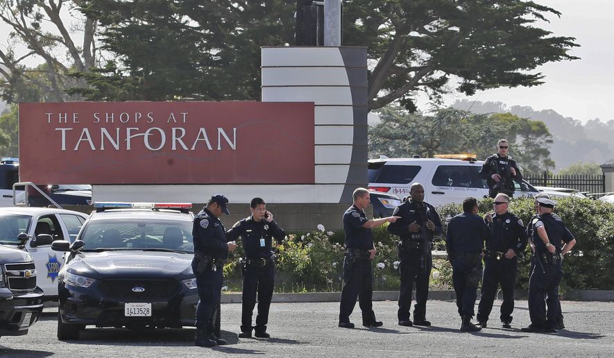 Police investigate at the scene of a shooting at the Tanforan Mall in San Bruno, Calif., Tuesday, July 2, 2019. Police are searching for suspects after at least two people were wounded in a mall shooting near San Francisco on Tuesday that led to region-wide transit delays at rush hour. (AP Photo/Stephanie Mullen)