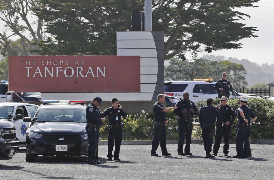 Police investigate at the scene of a shooting at the Tanforan Mall in San Bruno, Calif., Tuesday, July 2, 2019. Police are searching for suspects after at least two people were wounded in a mall shooting near San Francisco on Tuesday that led to region-wide transit delays at rush hour. (AP Photo/Stephanie Mullen)