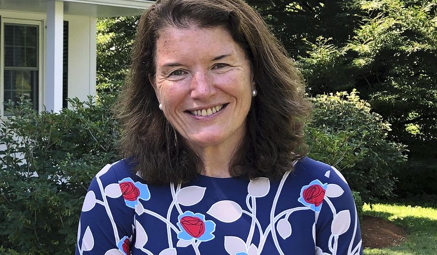 Kathleen Carroll Giles, new rector for St. Paul's School, poses for a photo, Tuesday, July 2, 2019, at the school in Concord, N.H. Giles acknowledges there's work to be done to address decades of sexual abuse claims involving at least 20 former faculty members and administrators. (AP Photo/Michael Casey)