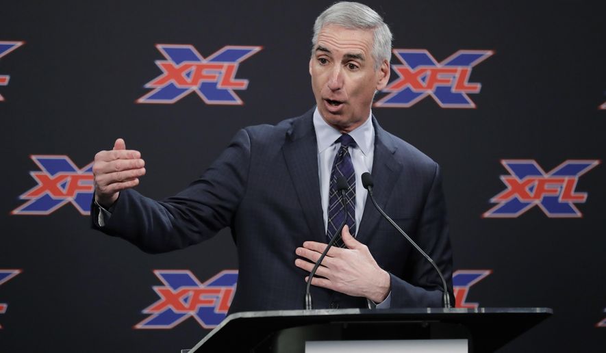 In this Feb. 25, 2019, file photo, XFL Football Commissioner Oliver Luck talks to reporters before introducing former NFL football quarterback Jim Zorn as the head coach for Seattle&#x27;s XFL football team, in Seattle. Oliver Luck’s first year as the XFL’s commissioner has mostly been confined to the office and getting the league’s framework set up. The next couple months though are what Luck refers to as the fun part of preparing for next year’s return. (AP Photo/Ted S. Warren) **FILE**