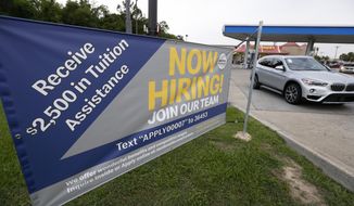 This June 21, 2019, photo shows a &amp;quot;now hiring&amp;quot; sign at a McDonald&#39;s restaurant in Moss Point, Miss. On Wednesday, July 3, payroll processor ADP reports how many jobs private employers added in June. (AP Photo/Rogelio V. Solis)