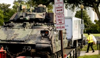 One of two Bradley Fighting Vehicles is parked nearby the Lincoln Memorial for President Donald Trump&#39;s &#39;Salute to America&#39; event honoring service branches on Independence Day, Tuesday, July 2, 2019, in Washington. President Donald Trump is promising military tanks along with &amp;quot;Incredible Flyovers &amp;amp; biggest ever Fireworks!&amp;quot; for the Fourth of July. (AP Photo/Andrew Harnik)