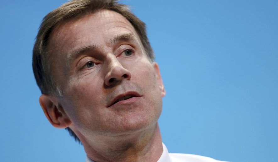 FILE - In this June 22, 2019, file photo, Britain's Foreign Secretary Jeremy Hunt addresses Conservative Party members in England's Birmingham, Britain. China's foreign ministry has lashed back at remarks by Hunt about the causes of recent anti-government protests in the former British colony of Hong Kong. (AP Photo/Rui Vieira, File)