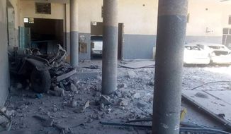 This image taken on a mobile phone on Wednesday July 3, 2019 shows the damage inside the detention center in Tripoli&#39;s Tajoura neighborhood after an airstrike. Libyan officials say an airstrike has struck a detention center for migrants in the capital, killing at least 40 people and wounding dozens. The airstrike was likely to raise further concerns about the European Union&#39;s policy of partnering with Libyan militias to prevent migrants from crossing the Mediterranean, which often leaves them at the mercy of brutal traffickers or stranded in squalid detention centers near the front lines. (AP Photo)