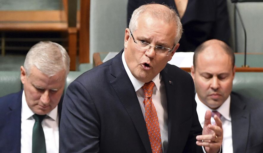 Australia&#x27;s Prime Minister Scott Morrison speaks at the despatch box during Question Time in the House of Representatives at Parliament House in Canberra, Thursday, July 4, 2019. (Sam Mooy/AAP Image via AP) ** FILE **