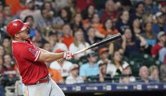 Los Angeles Angels&#39; Mike Trout hits a home run against the Houston Astros during the eighth inning of a baseball game Friday, July 5, 2019, in Houston. (AP Photo/David J. Phillip)