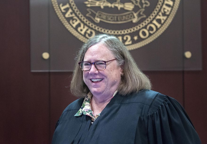 This Aug. 11, 2017 photo shows District Judge Sarah Singleton smiling after a ruling in Santa Fe, N.M. Singleton, a retired district court judge who presided over multiple landmark cases in New Mexico, has died at 70, officials said Friday, July 5, 2019. (Eddie Moore/The Albuquerque Journal via AP)