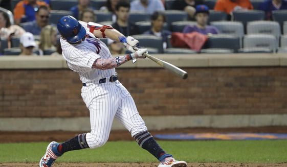 New York Mets&#x27; Pete Alonso hits a home run during the fourth inning of the team&#x27;s baseball game against the Philadelphia Phillies on Friday, July 5, 2019, in New York. (AP Photo/Frank Franklin II)