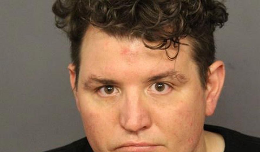 This July 3, 2019, photo provided by the Denver Police Department, shows Joshua Hensley, 38, a guard at a Colorado women's prison who was arrested Wednesday on suspicion of attempted pimping and patronizing a prostitute. Investigators believe he was trying to coerce at least two women to work as prostitutes for him, court records state. (Denver Police Department via AP)