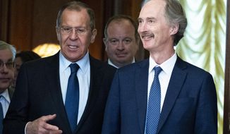 United Nations Special Envoy for Syria Geir Pedersen, center, and Russian Foreign Minister Sergey Lavrov, second from right, enter a hall during their meeting in Moscow, Russia, Friday, July 5, 2019. Pedersen voiced hope that cooperation between Russia and Turkey will help stabilize the situation in Syria&#39;s northwestern provice of Idlib. (AP Photo/Pavel Golovkin)