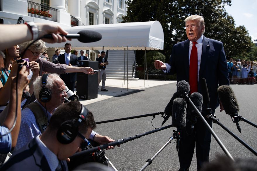 President Donald Trump talks to reporters on the South Lawn of the White House before departing for his Bedminster, N.J. golf club, Friday, July 5, 2019, in Washington. (AP Photo/Evan Vucci)