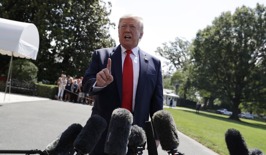 President Donald Trump talks to reporters on the South Lawn of the White House before departing for his Bedminster, N.J. golf club, Friday, July 5, 2019, in Washington. (AP Photo/Evan Vucci)