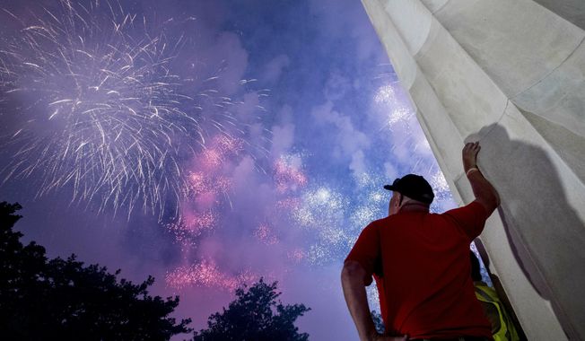 Fireworks seen from the Lincoln Memorial explode over the Potomac River for Independence Day, Thursday, July 4, 2019, in Washington. (AP Photo/Andrew Harnik) ** FILE **
