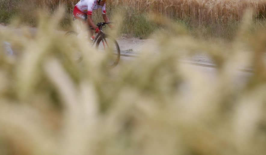 France's Stephane Rossetto rides during the first stage of the Tour de France cycling race over 194.5 kilometers (120,86 miles) with start in Brussels and finish in Brussels. Saturday, July 6, 2019. (AP Photo/Thibault Camus)